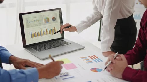 Close up of business hands are working and brainstorming on paperworks.