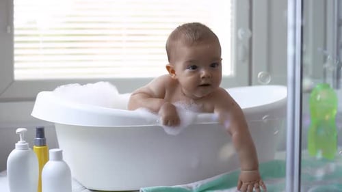 Adorable Baby Taking a Bath with Bubbles