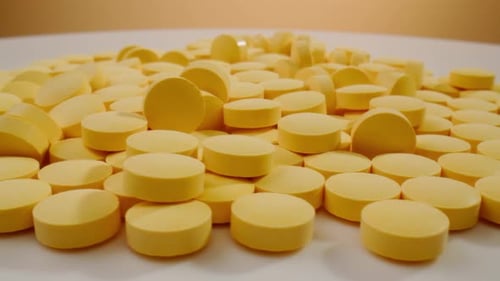 Pills and Vitamins Macro Close Up View of Womans Hands Holding Plenty of Different Drugs Painkillers