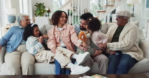 Multigenerational Family Smiling on Couch Together
