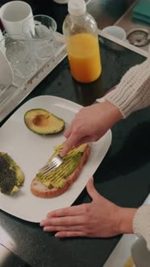 Preparing Healthy Avocado Toast for Breakfast at Home