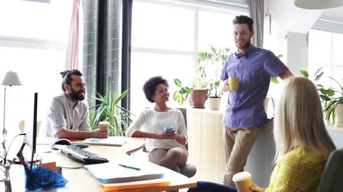 Professionals Meeting at a Table in Modern Office