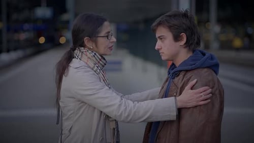 Mother Saying Goodbye to Son Waving Hands and Leaving Unhappy