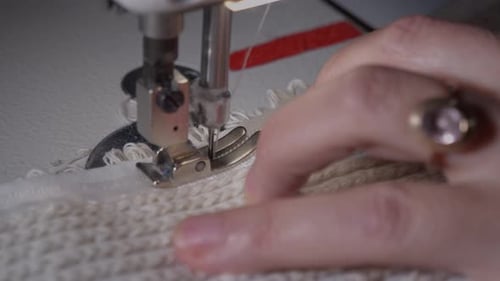 Close Up Sewing Machine Stitching White Knit Fabric