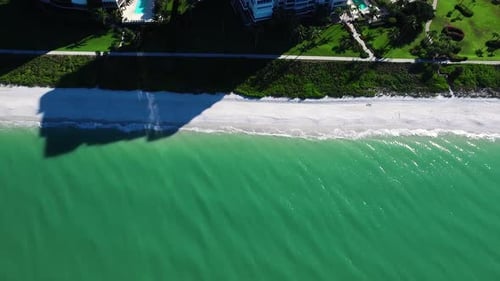 Aerial View of Beachfront Condos on Sunny Day