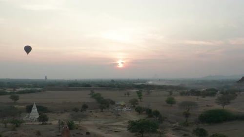 Morning scenery at famous Bagan temple site with hot air balloons, aerial