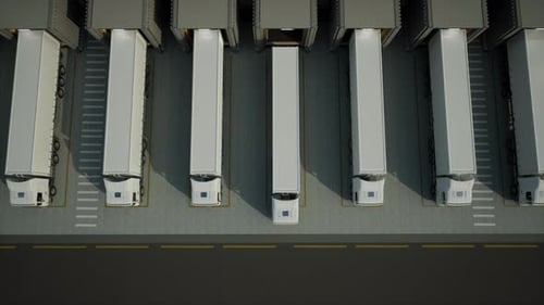 Trucks With Cargo Trailer At Loading Docks Of A Warehouse