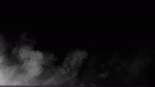Mojave Collection: Dust smoke effect blowing continuously from the right over a flat surface shot at