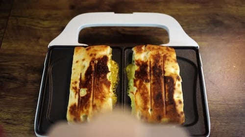 Toasted Sandwiches Cooking in a Sandwich Press