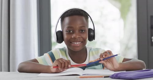 African American boy studies at home