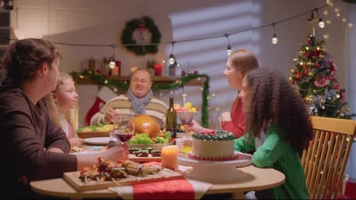 Family Celebrating Holiday Dinner Together at Home