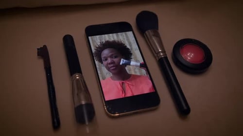 Beauty Influencer Video on Phone With Makeup Brushes