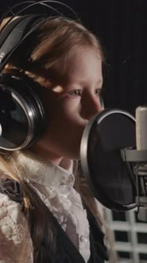 Child Sings Song in Audio Recording Studio