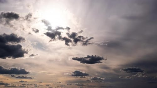 Timelapse of Cumulus Clouds Moving In The Blue Sky Against The Sun