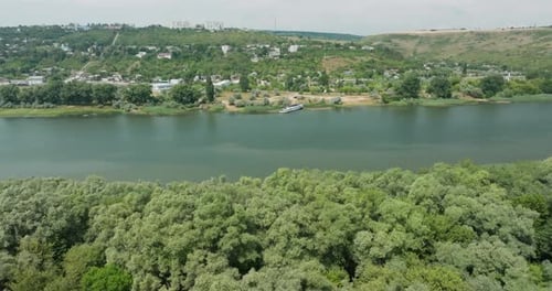 crossing of two rivers in the direction of a moored ship in a small settlement