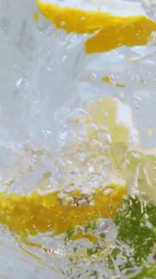 Vertical View Of Lemon into fresh water