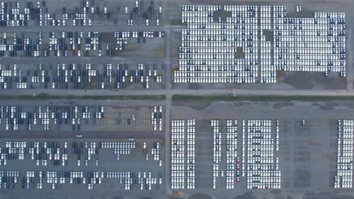 Aerial view from drones flying over a lot of cars