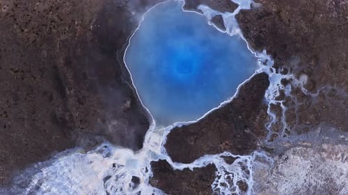Aerial Top Down View of a Deep Blue Geothermal Pool in Iceland
