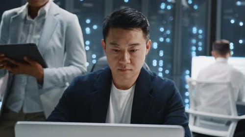 Multiethnic Modern IT Technicians Cooperating in Database Center Modern Hightech Office with Server