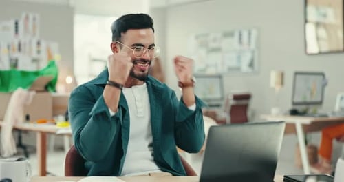 Business, laptop and man with winner fist celebration in office with good news
