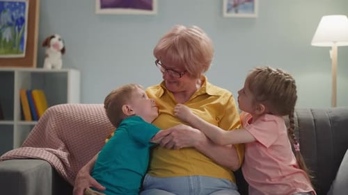 Grandmother Hugged by Grandchildren on Couch