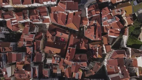Aerial view of red rooftops and narrow streets, Portugal.
