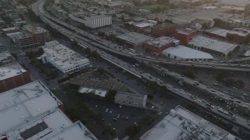 High Angle View of Busy Transport Infrastructure in Metropolis at Twilight Streams of Vehicles on