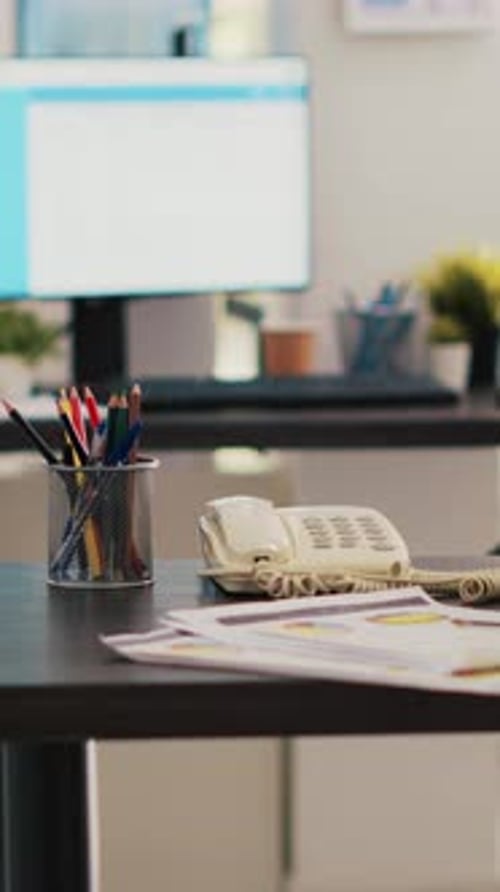 Vertical Video Stock Market Diagrams with Charts and Stock Figures on Laptop Sitting on Desk
