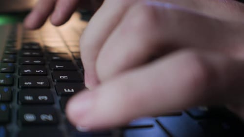 Male Programmer Typing on Keyboard