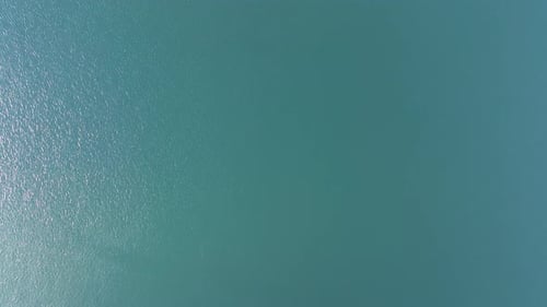 Overhead View Of Calm Blue Waters On A Sunny Day. - aerial