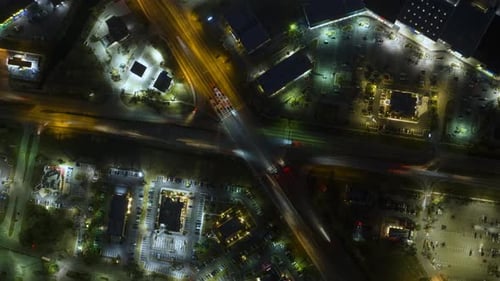 Top View of Large Multilane Road Intersection with Traffic Lights and Moving Cars in American City