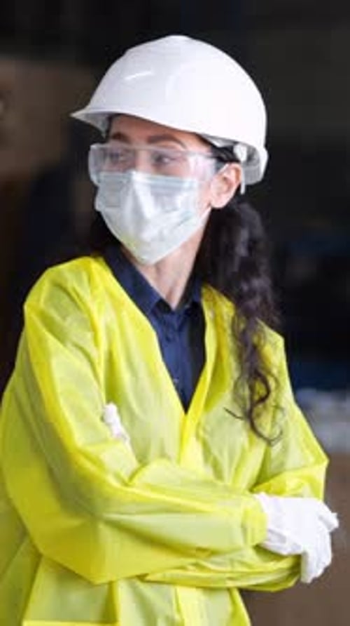 Female Employee Monitoring Assembly Line Woman With Protective Equipment Overseeing Manufacturing