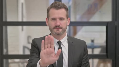 Portrait of Middle Aged Businessman with Stop Gesture
