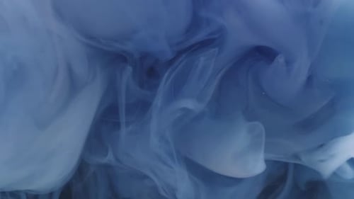 Swirling Blue and White Plumes in Liquid