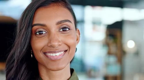 Smiling Woman's Radiant Close-Up Portrait in Office