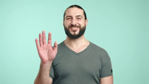 Friendly Bearded Man Smiling and Waving Hello