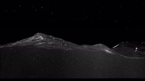 Submerge Collection: Waves of water drifting slowly from the right side over a black background