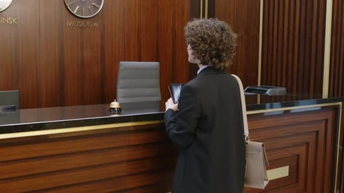Female Guest Introducing to Administrator at Hotel Reception
