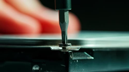 Tightening Screw on Computer Part, Close Up