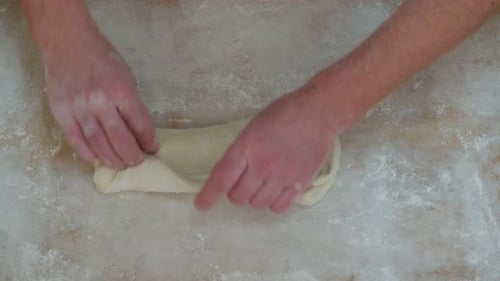 Closeup Shot of Hands of Senior Bakery Chef Applying Flour on Dough Man Kneading Dough Making Bread