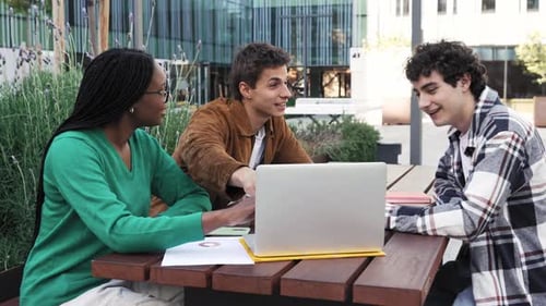 Group of International University Students Using Laptop Working and Learning Together Discussing