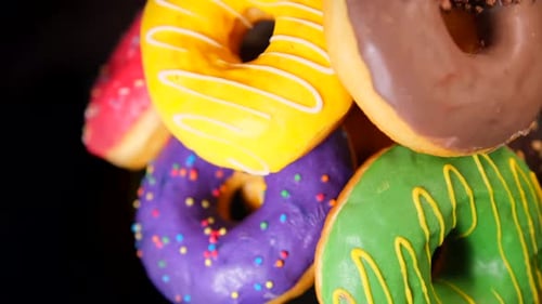 Colorful Donuts Stacked High, Close Up View
