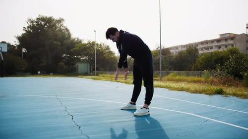 Stretching Before a Basketball Match at the Park