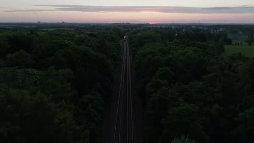 Aerial Retreat From Oncoming Suburban Train
