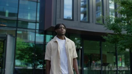 Confident Man Walking in Modern City