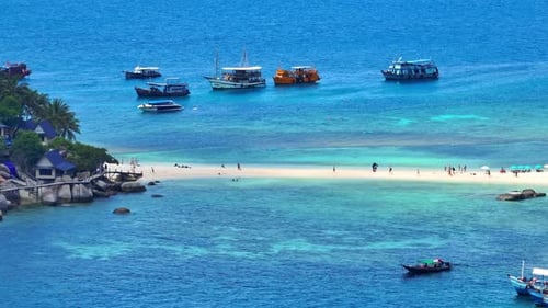Tropical Island Sandbar with Turquoise Water and Boats