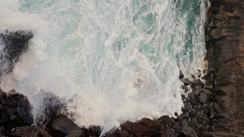 Waves Crashing and Foaming on Shore of Tenerife Meeting Deep Blue Ocean Water