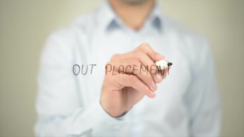 Man Writes Out Placement on Transparent Surface