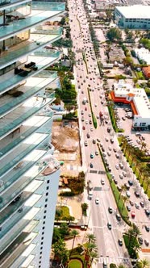 Aerial View of City Traffic and High-Rise Building