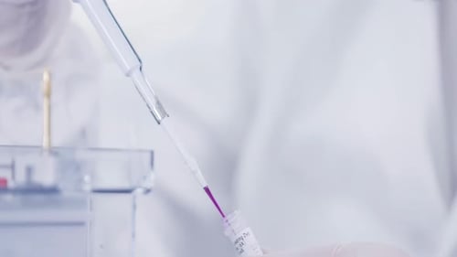 Close Up Lab Experiment with Purple Liquid